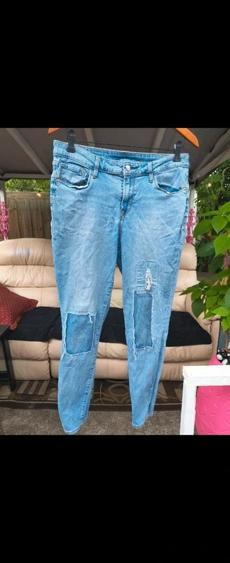 Women's blue jeans with rips and patches