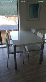 White gloss dining table with 4 chairs