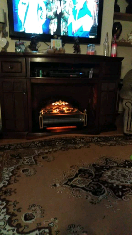 Fireplace Surround Including A Electric Fire In