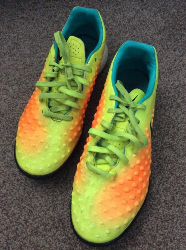 multi ground football boots on astro turf