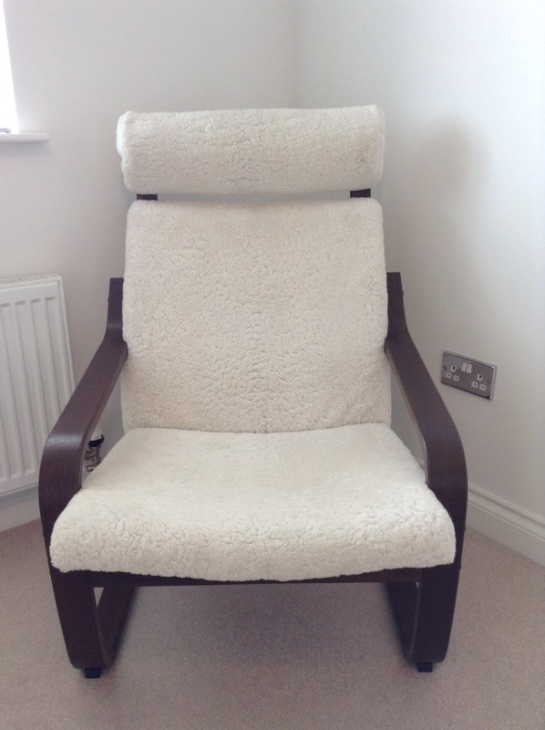 IKEA Poang chair; dark wood frame, rare sheepskin cover | in Falkirk