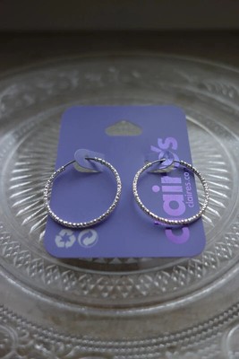 Neue glitzernde silberne Creolen von Claires
