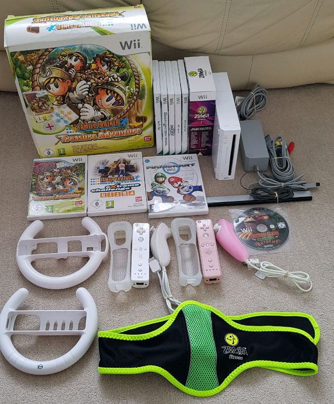Wii + 10 games inc mario kart, wii sports & family trainer mat in