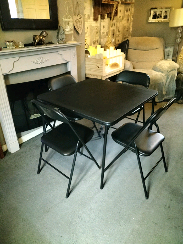 Folding table and four chairs feel free to contact me in Norwich