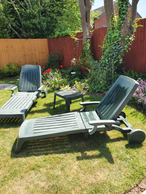 Pair of green sun loungers and table | in Broughton Astley