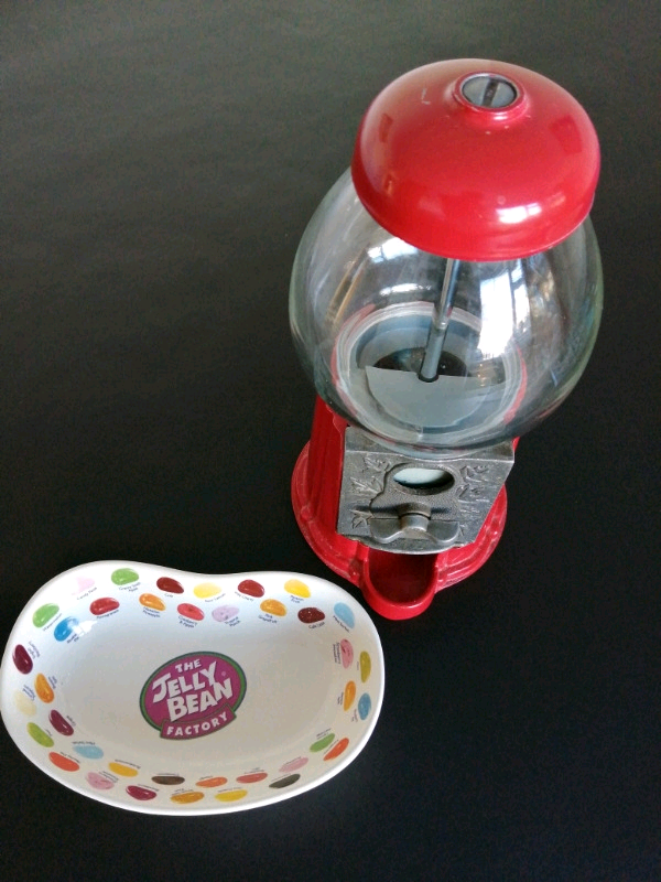 VINTAGE JELLY BEAN DISPENSING MACHINE WITH SMALL CERAMIC DISH . in