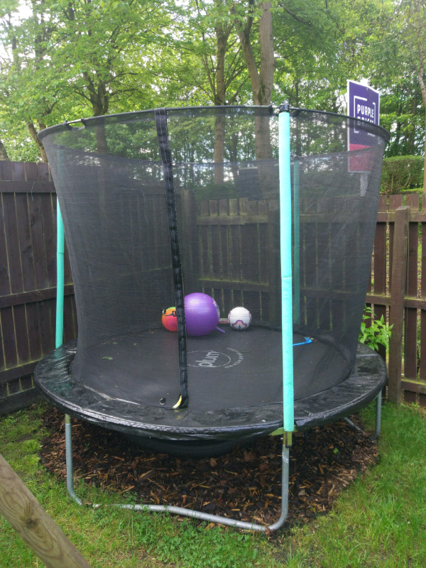 Plum 8 foot trampoline with safety net and rain cover in Glenrothes