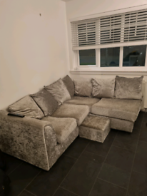 Corner sofa with footstool
