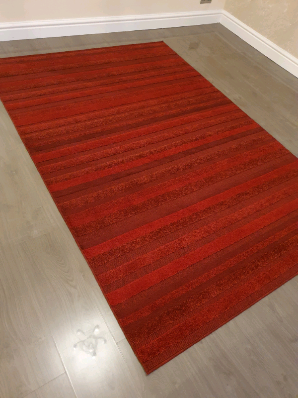 Red/ maroon extra large rug. Excellent condition in Stretford