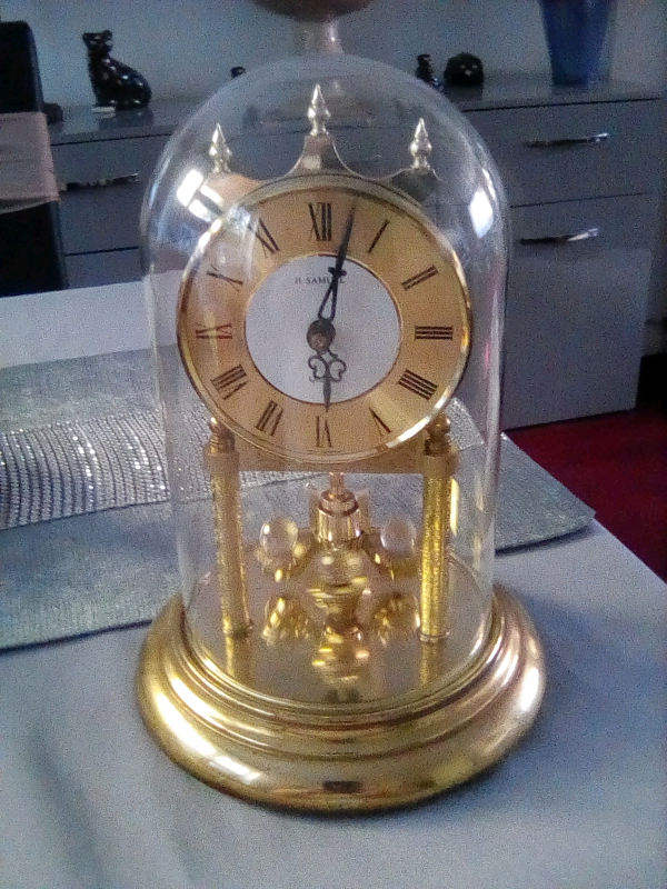Vintage H Samuel carriage clock, gold coloured with glass dome. in