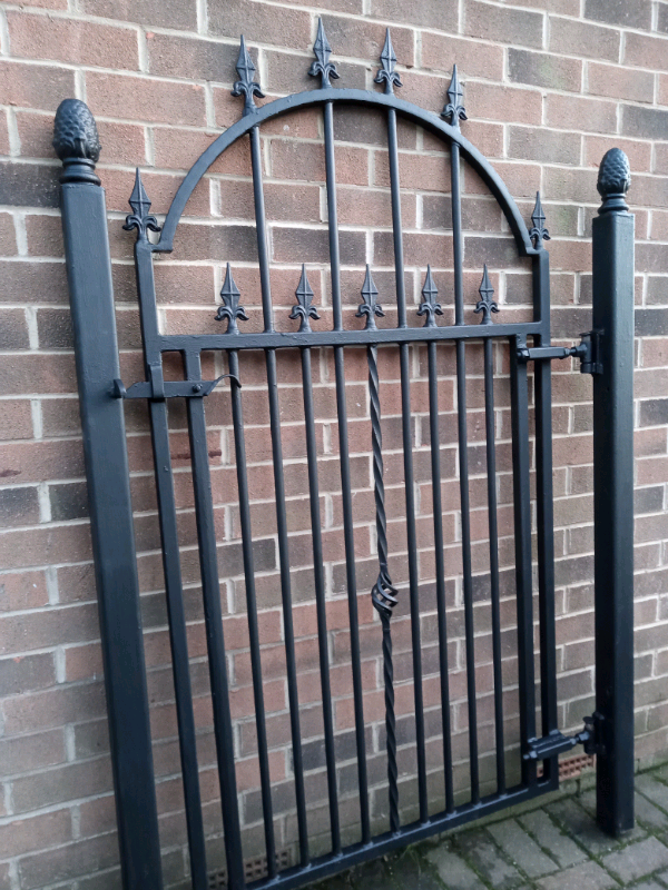 Large 6 foot tall very heavy duty wrought iron gate with posts in