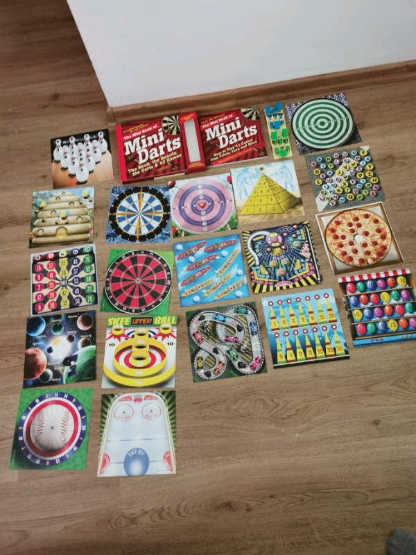 The mini book of mini darts the Book The boards the darts in