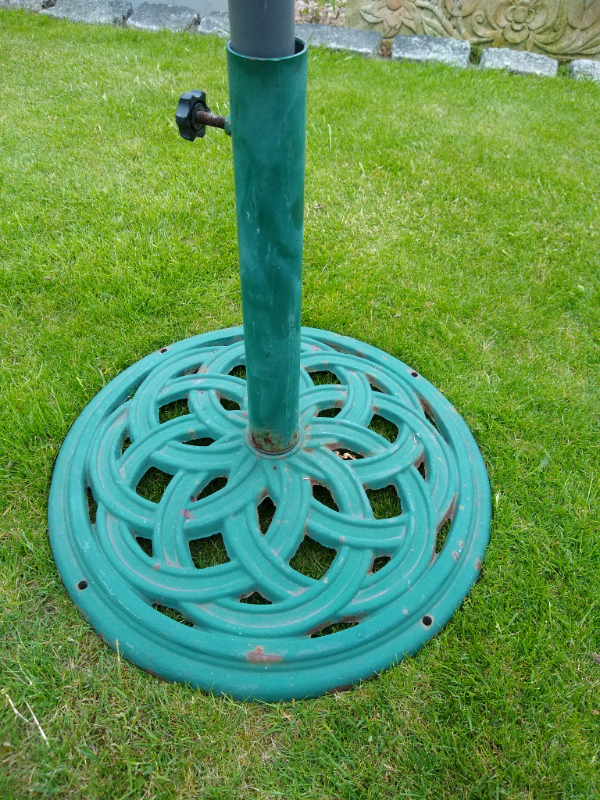 Green metal parasol or umbrella base / stand in Blackford, Edinburgh