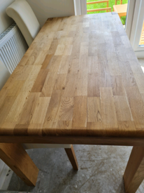 Harveys solid oak dining table. Seats up to 6. Table only.