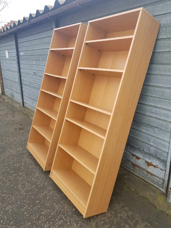 Two matching beech effect tall shelf units, delivery available in