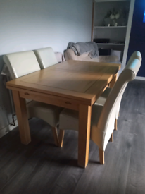 Oak extending dining table and chairs 