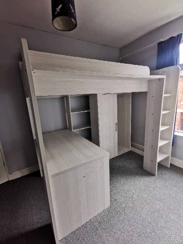 High sleeper single bed with wardrobe, bookshelf and desk underneath