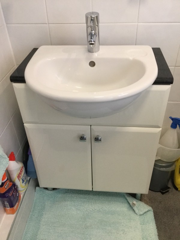 White wash basin with built in cupboard in Ferryhill, County Durham