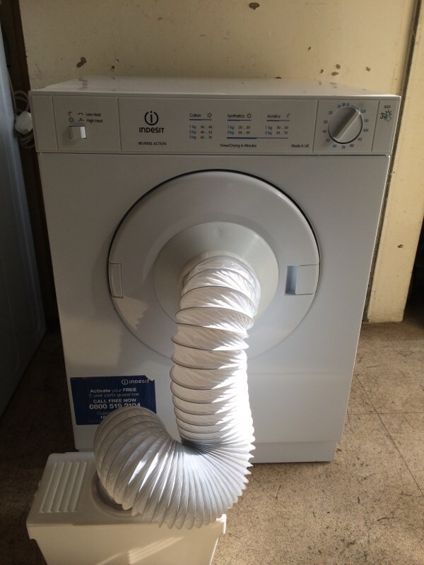 Indesit 3kg compact tumble dryer with vent hose and condenser box in