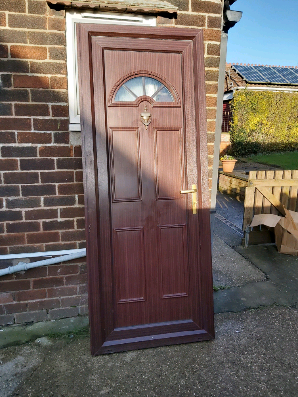 Mahogany woodgrain upvc door in good working order in Chesterfield