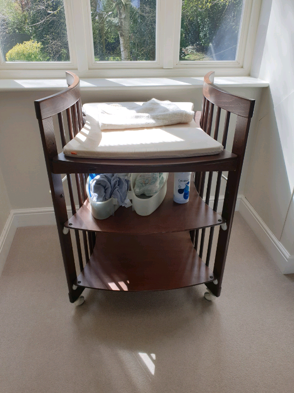 Stokke baby changing table. Dark wood. in Oundle, Cambridgeshire