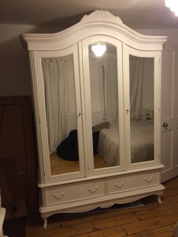 Two white French armoires white wooden wardrobes. Triple door