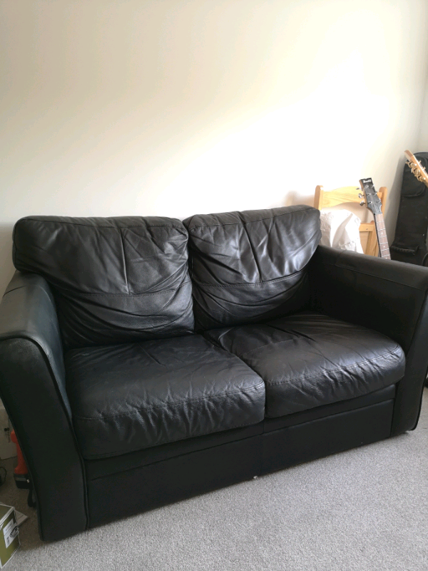 Black faux leather sofa for collection in Buckingham, Buckinghamshire