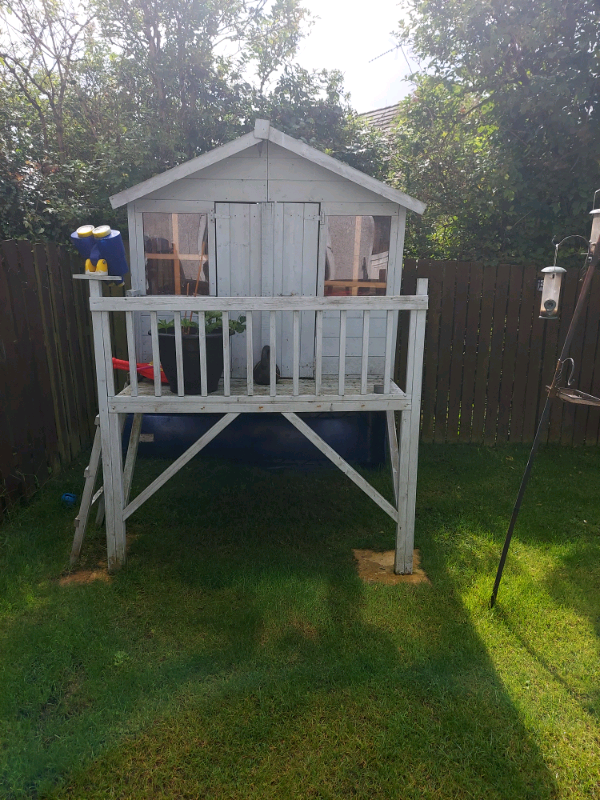 kids wooden tree house with slide in east end, glasgow