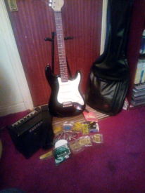 Electric guitar with amp and stand