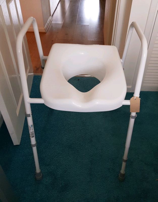 Orthopaedic raised toilet seat for impaired mobility, not used in