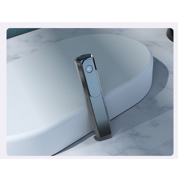 Modern bidet attachment on toilet side view.