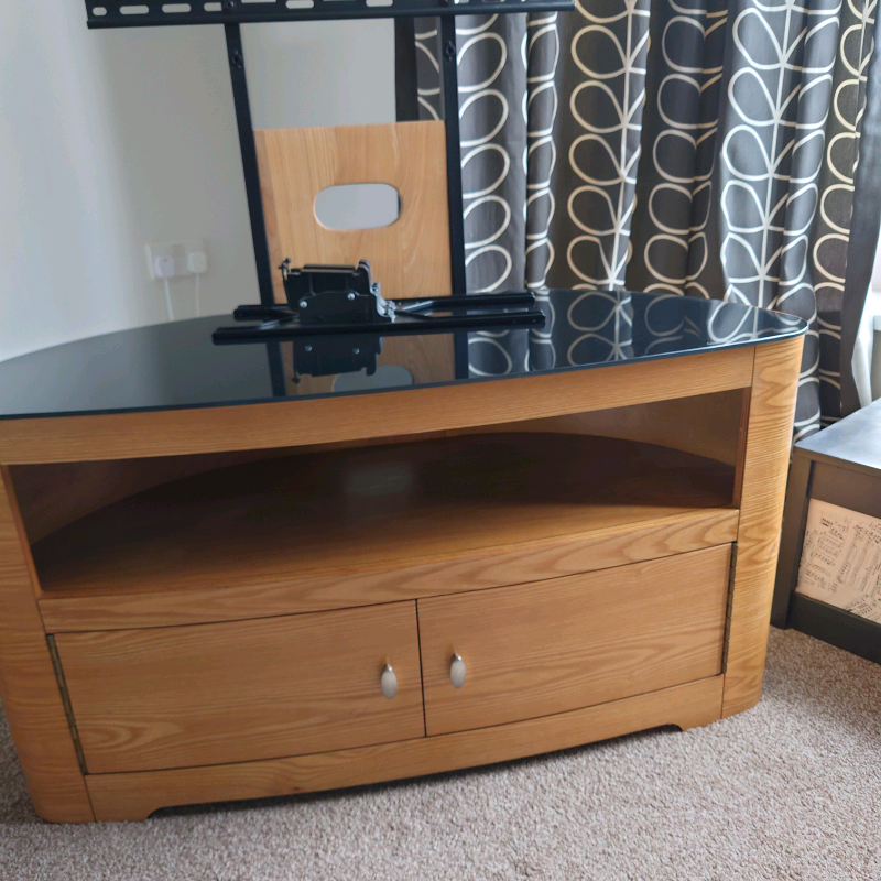 Light wood corner tv unit with black tempered glass top in Stockton