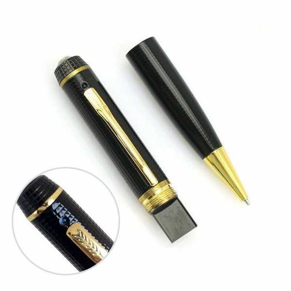 Disassembled black and gold pen with magnified detail.