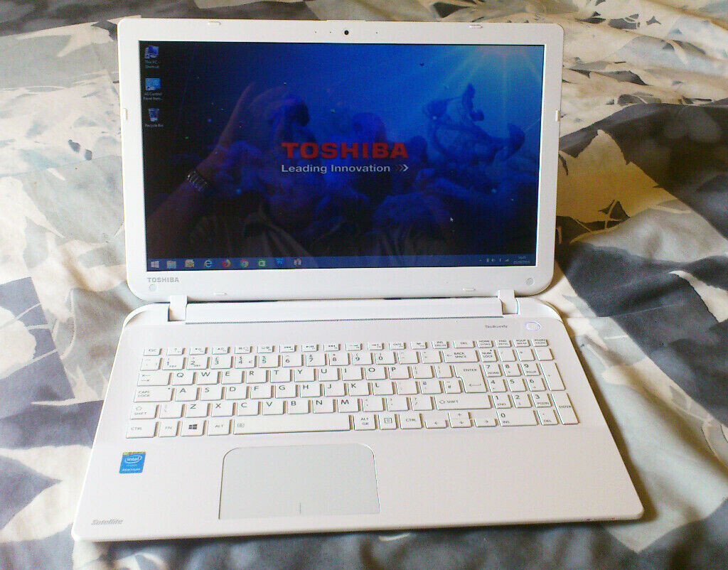Very Thin White Toshiba L50B1DZ 15.6 inch laptop. Intel quad core