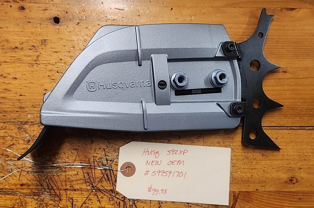 Husqvarna 592XP Autotune NEW OEM Clutch cover assembly w/ spikes 
