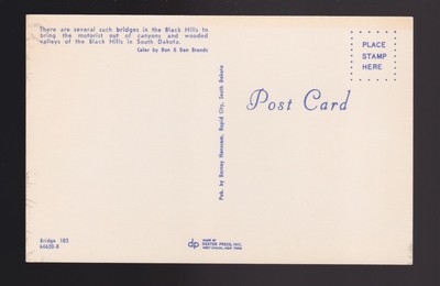 Pigtail Bridge in the Black Hills of South Dakota shows older station wagon car