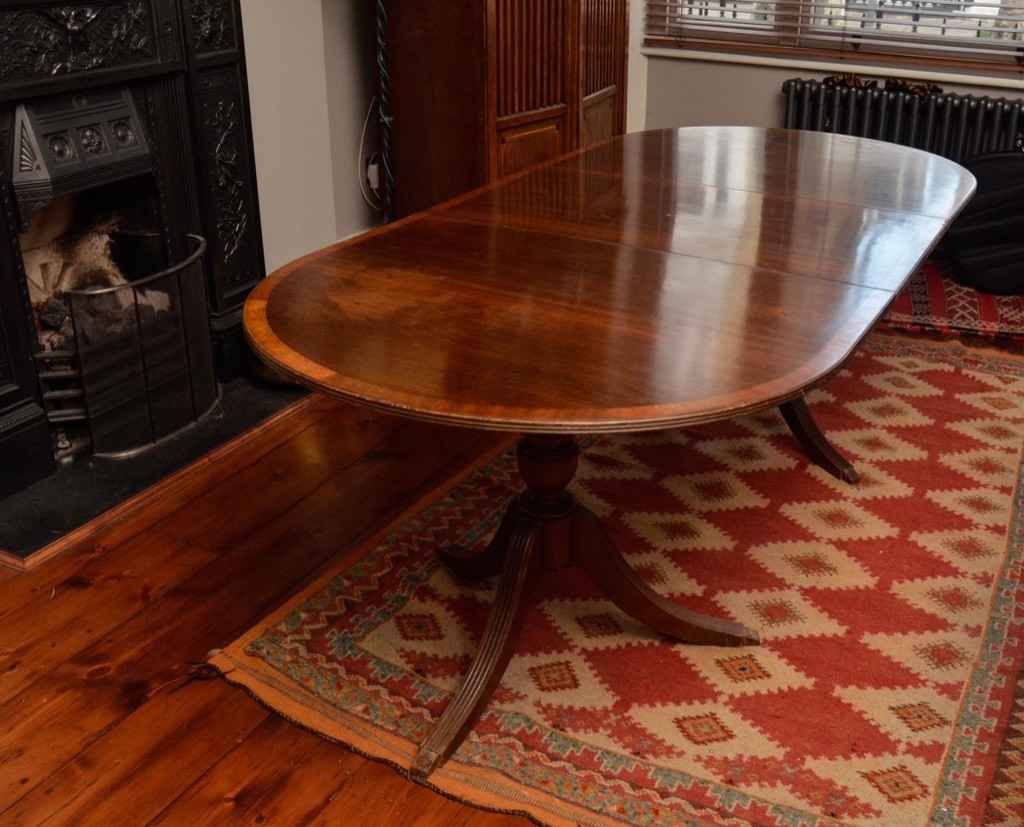 Good quality Georgian style dining table with one extension. | in Earls