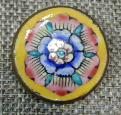 1 cupid button in painted enamels 1 and a half inch by 2 inch.