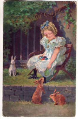 ANTIQUE EASTER Postcard    YOUNG GIRL SITTING ON CHAIR, FEEDING BUNNIES