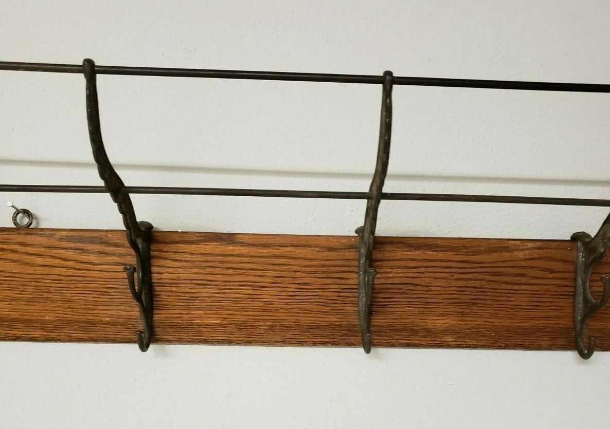 Antique Cast Iron Hooks on Oak Wood 31