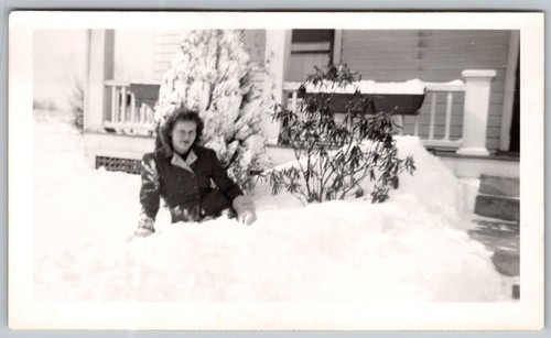 Vtg B&W Snapshot Woman Sitting In Deep Snow By House Porch Winter Scene 1940s