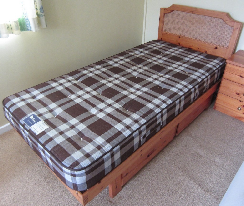 Two used single pine framed beds with drawers and headboard in Stroud