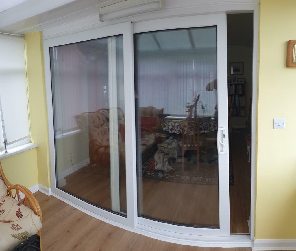 WHITE UPVC SLIDING PATIO DOORS. 2390 W x 2040 H inc CILL in