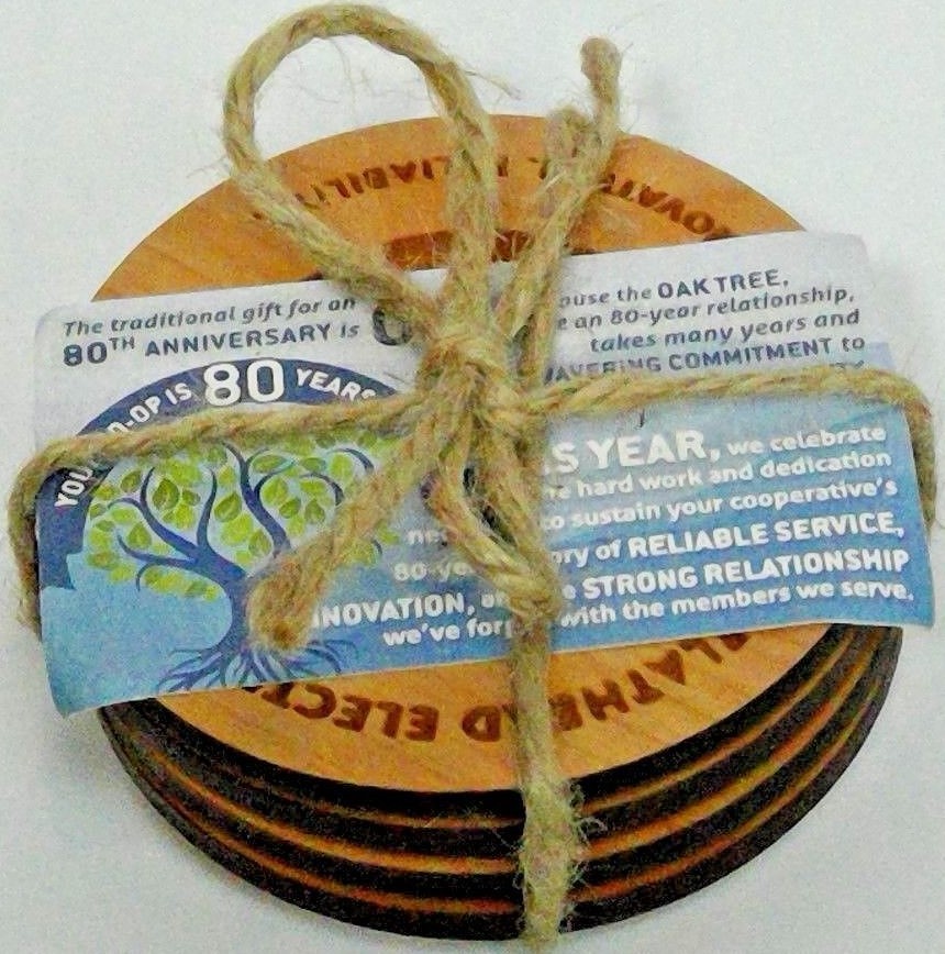 set 4 oak coasters Flathead Electric Coop logo 'Communication/Innovation...'