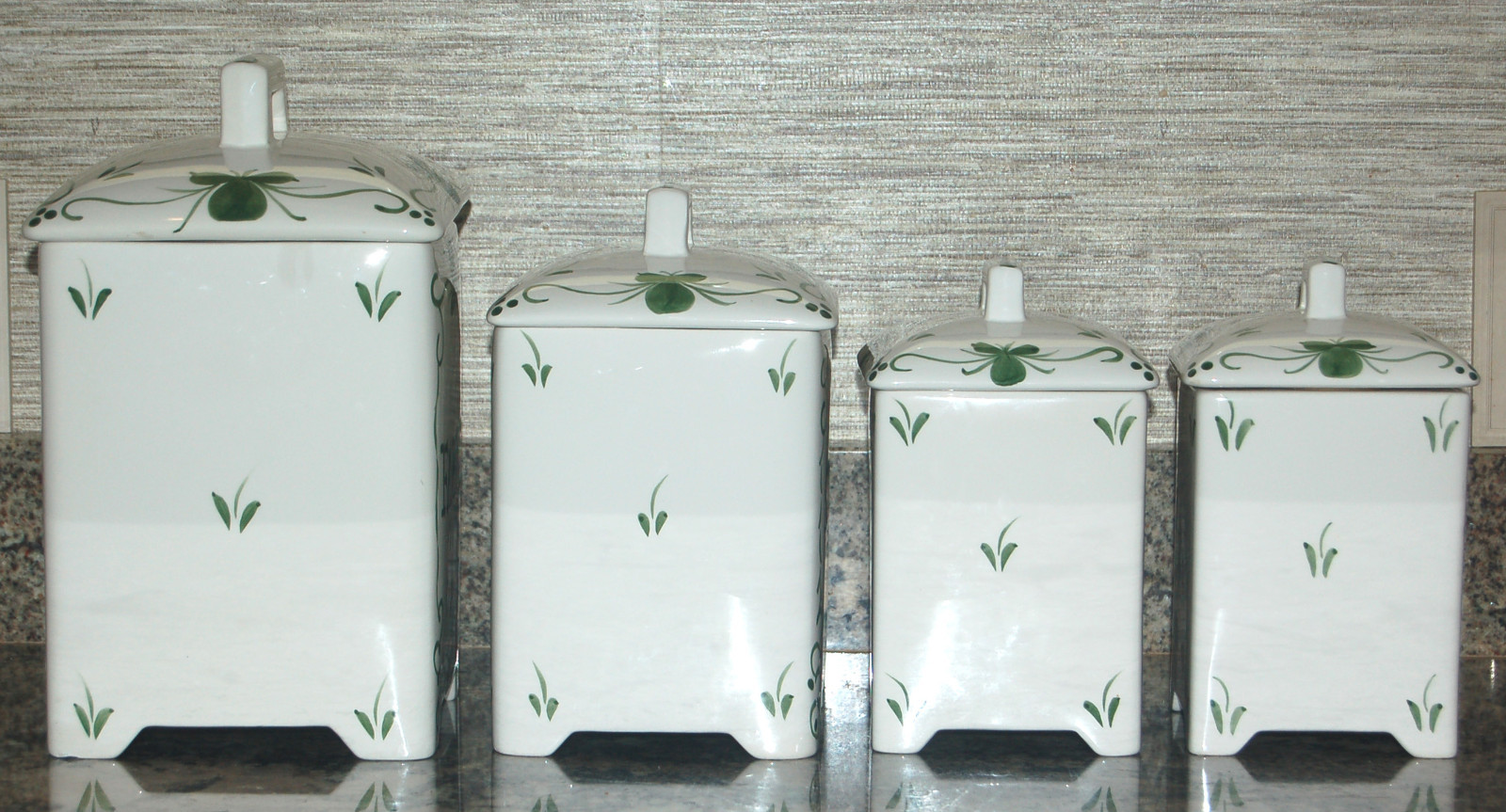 FOUR GREEN AND WHITE FRENCH FARMHOUSE CANISTERS BY 'J WILLFRED' ANDREA BY SADEK
