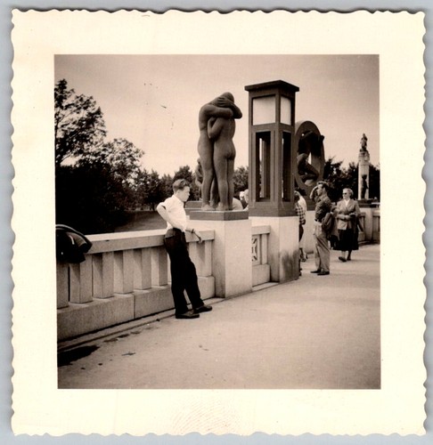 Vtg B&W Snapshot Teenage Boy Leaning On Bridge Sculpture 1950s