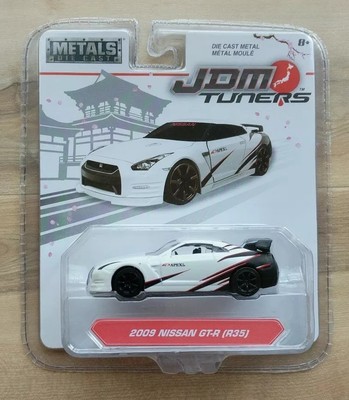 JADA METALS DIE CAST JDM TUNERS 2009 NISSAN GT-R (R35) 1/64 WHITE APEXI.