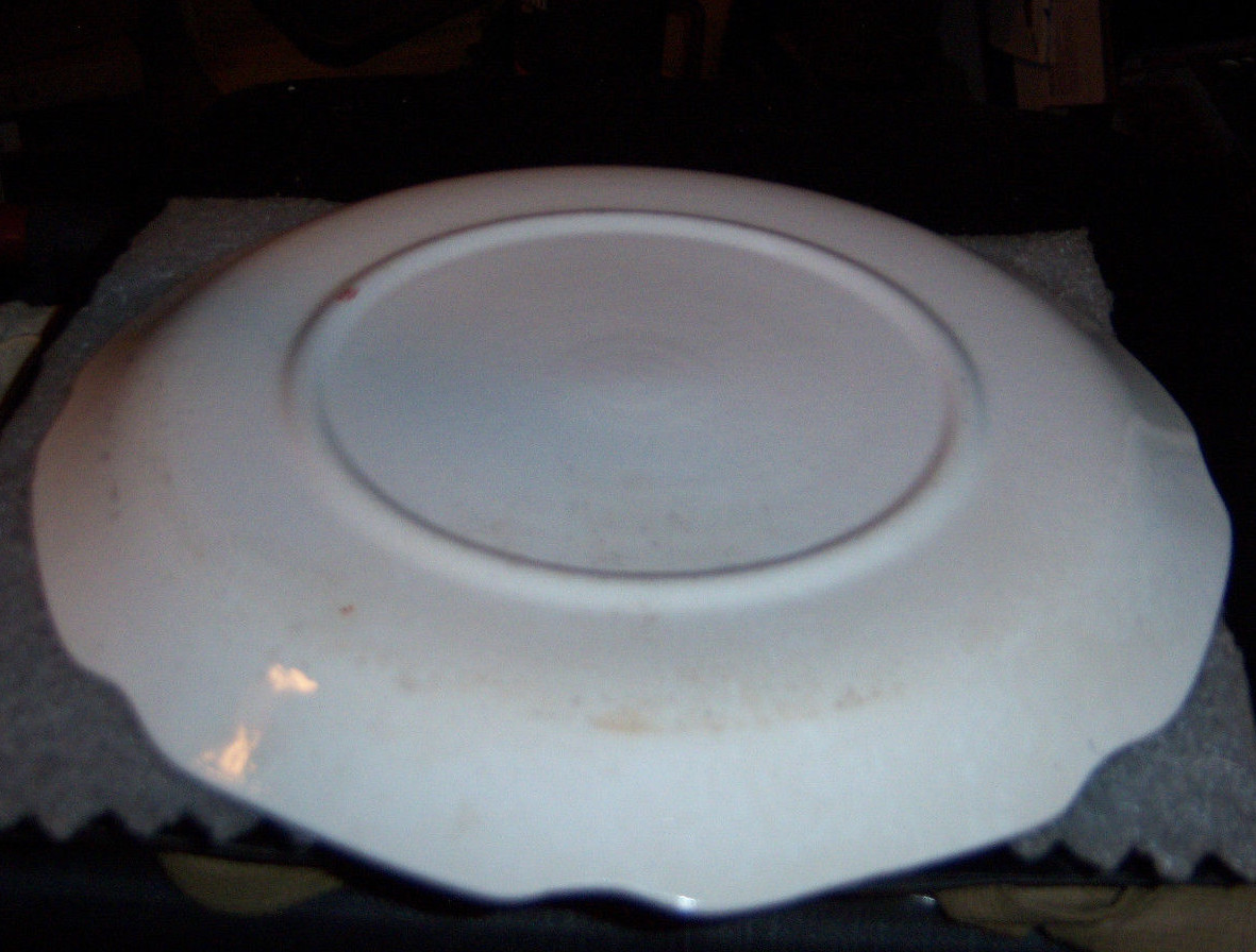 California collector plate edged with gold trim 7” round showing the San Francis