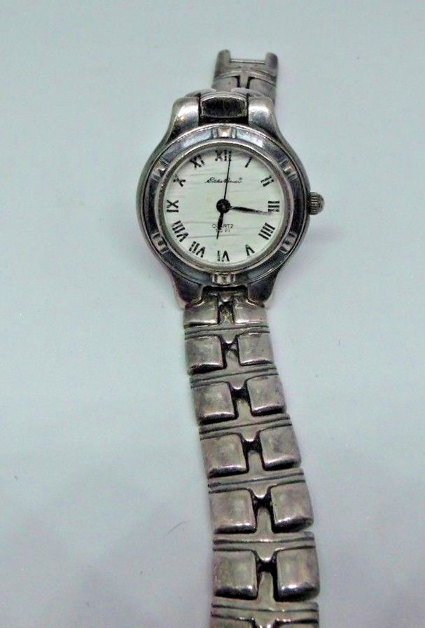 Lady's Eddie Bauer watch for parts or repair. Back cover is missing.