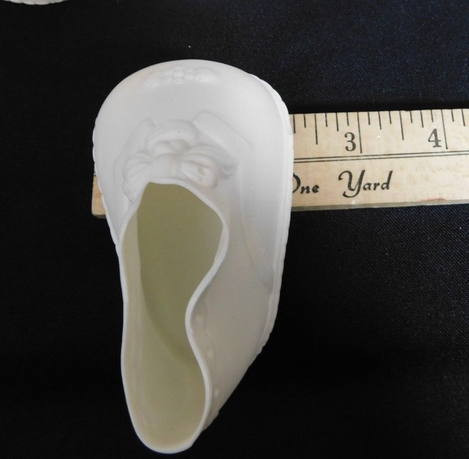 6 Pairs of Vintage White High Top Baby Doll Shoes